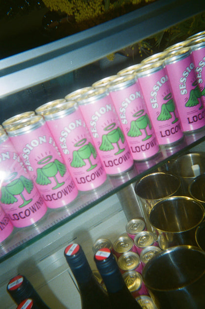 Session Fizz organic canned wine lined up on a bar at an event by Loco Wines